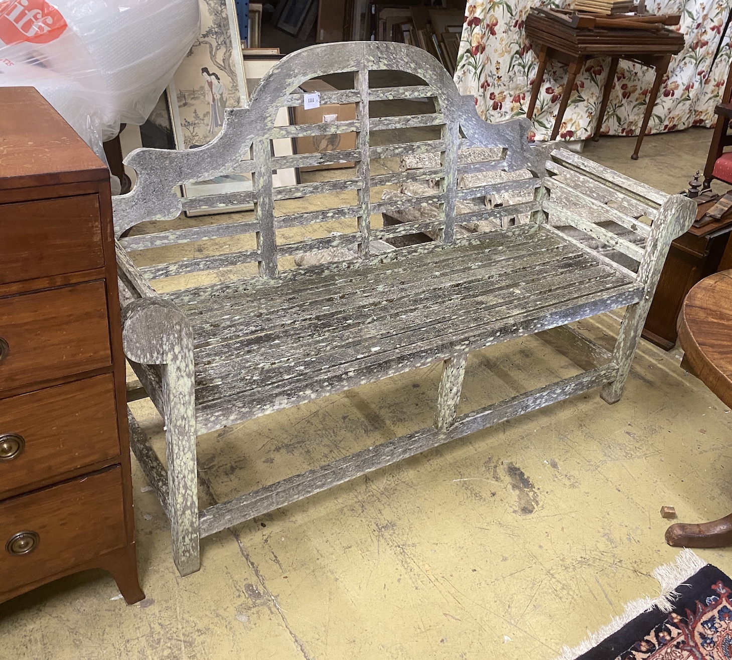 A Lutyens style weathered teak garden bench, length 164cm, depth 50cm, height 103cm